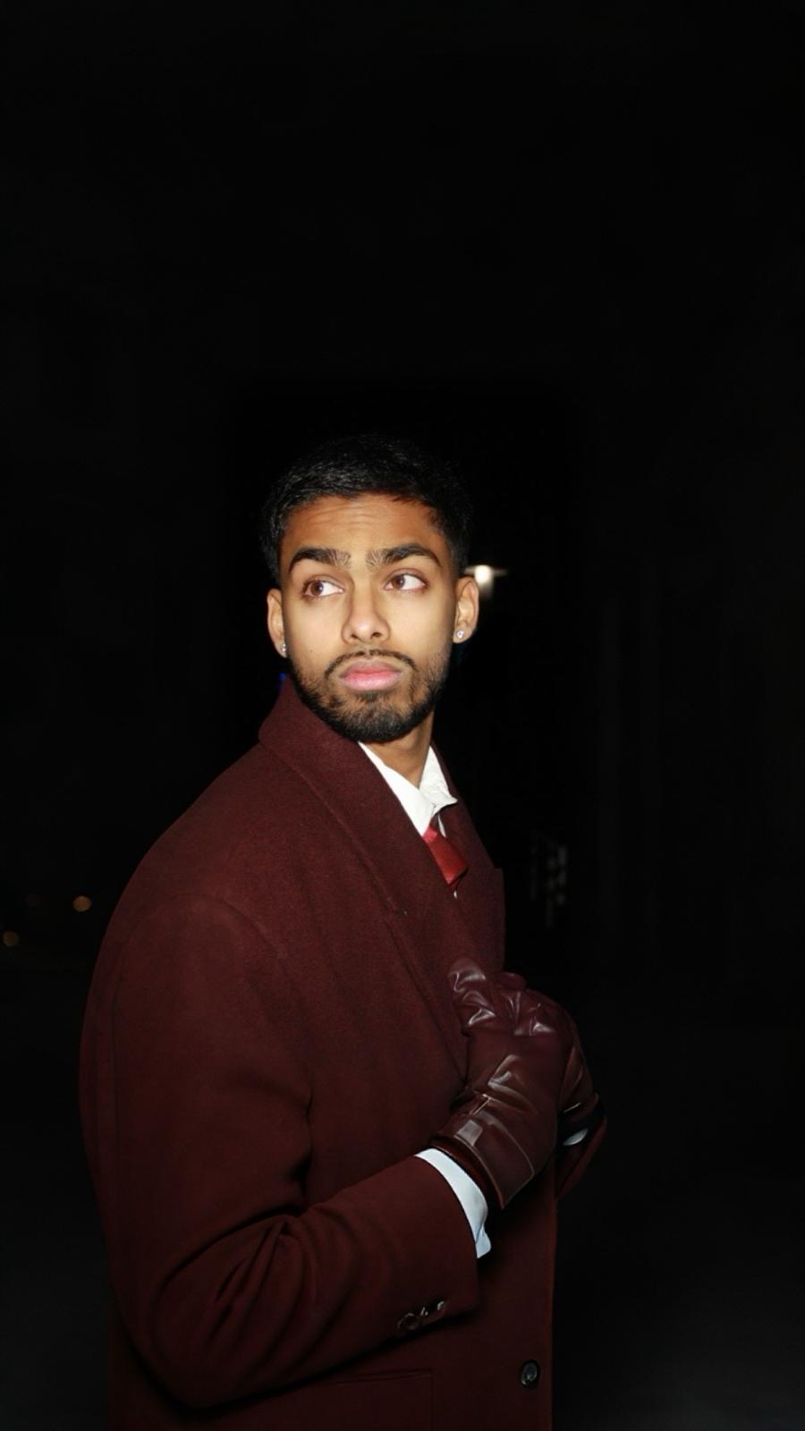 Ragul Mayavan in a burgundy coat